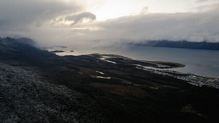 An aerial image of Puerto Williams and mountains with early snowfall