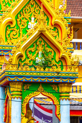 Suwankeereewong Temple wat golden Buddhist architecture details in Patong Thailand.