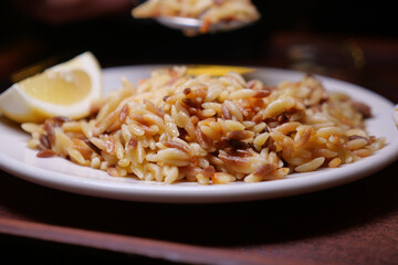 Delicious orzo pasta with lemon served on a plate