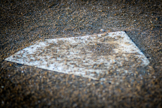 A sand covered home plate - horizontal - Powered by Adobe