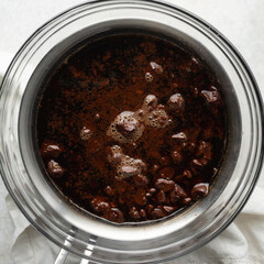 Overhead view of Dark chocolate ganache being melted in a double boiler