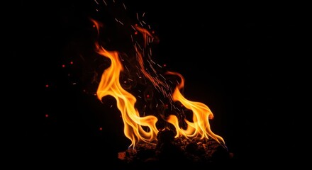 Obraz premium Fiery Flames Dancing in the Dark: A Vivid Display of Combustion and Sparks