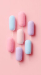 Cotton candy sticks arranged in pastel festive flat lay
