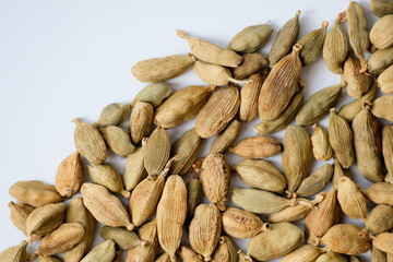 Organic dried green cardamom pods isolated on a white background