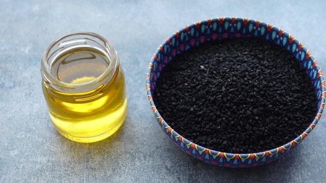 black cumin seed and oil on a table 