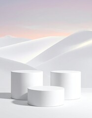 Three white cylinders on white dunes under a pale sky