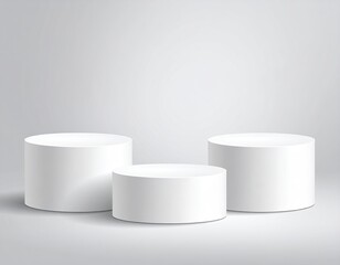 Three white cylinder pedestals in a softly lit studio scene