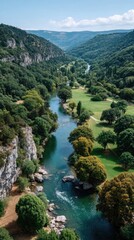 Wide Verdant Valley With A Flowing Blue River On A Sunny Day With Rocky Cliffs And Lush Green Trees