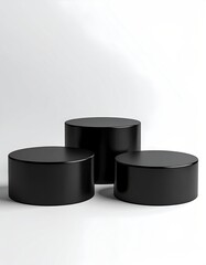 Three black cylindrical platforms on a white background