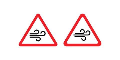 Obraz premium Two identical triangular road signs warning of strong crosswinds or gusts of wind on the road