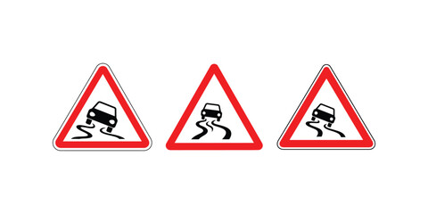 Three triangular road signs warning of slippery road conditions with cars skidding