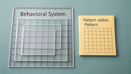 Clear Plastic Grids and Yellow Notebook with Graph Paper on Soft Blue Background for Educational or Creative Projects