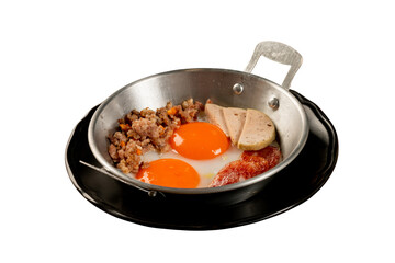 Delicious fried eggs served in a pan with various sides