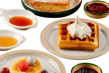 Delicious breakfast spread featuring waffles, toast, and fruit-topped pancakes, all artfully presented