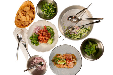 A top-down view of food ingredients neatly arranged on plates and bowls 