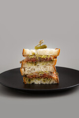 Onion caramelized pesto sandwich with Sourdough bread, Tomato and pickle.