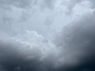 A dense blanket of dark, heavy grey clouds, suggesting an approaching storm, rain, or a heavily overcast sky.