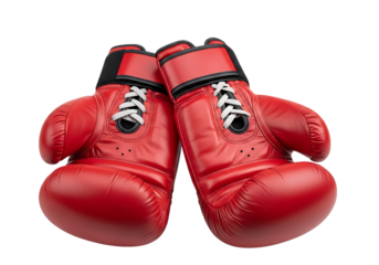 Red boxing gloves with laces isolated on a black background