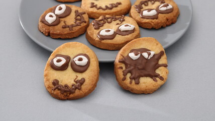 homemade fun baking, and Halloween celebration for kids. Creative cookies, top view. Concept of Halloween celebration, fun baking, and sweet childhood moments