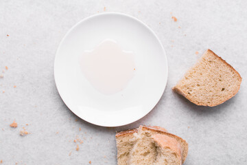 Overhead view of sliced homemade artisan bread with a plate of oil