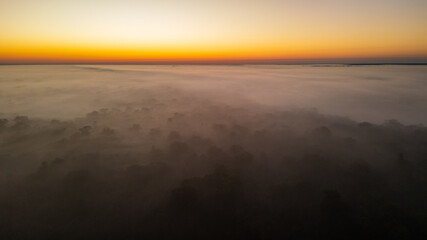 Fototapeta premium Aerial images of the Amazon rainforest of Madre de Dios, clouds over the trees in Tambopata, Peru