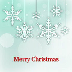 pale green Background with Hanging Snowflake Designs for Christmas Greeting Card