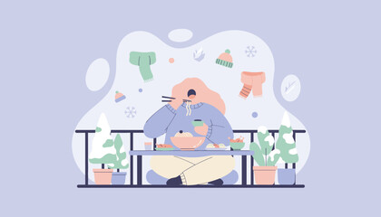 A woman enjoying hot noodles outdoors on a snowy winter balcony Cozy comfort food concept