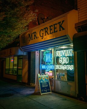 Mr. Greek sign at night on Elmwood Avenue in Buffalo, New York