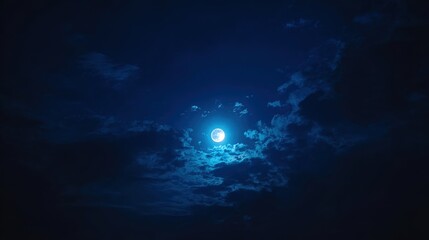 Fototapeta premium phase. Dramatic night sky featuring a full moon with subtle cloud details, evoking a serene celestial atmosphere. travel magazines, destination branding, designed for travel destination branding.