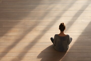 Woman Sitting on Sunlit Wooden Floor