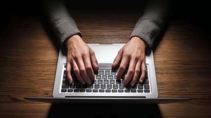 Focused individual actively typing on modern laptop keyboard engaged in digital work showcasing productivity and technology use.
