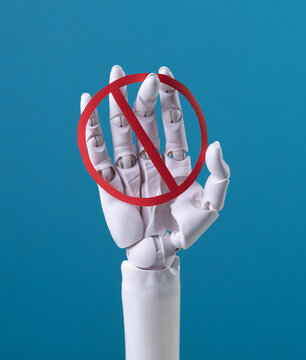 AI Prohibition: Robotic Hand Holding a Red No Sign