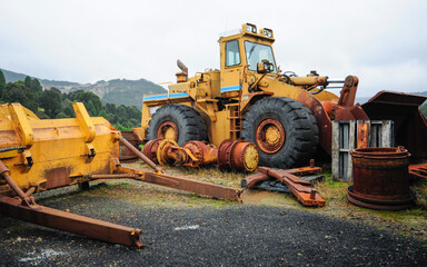 Abandoned 1960s Era Yellow Front End Loader on a Wet Day in Waratah, Tasmania Tarkine Region 