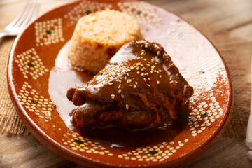 Mole Poblano. Chicken with Mole. Typical dish, emblematic of Mexican food made with a mixture of numerous ingredients. Mole sauce is commonly served with chicken or turkey.