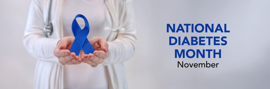 Doctors Hands Presenting Blue Awareness Ribbon - Diabetes Awareness Concept
