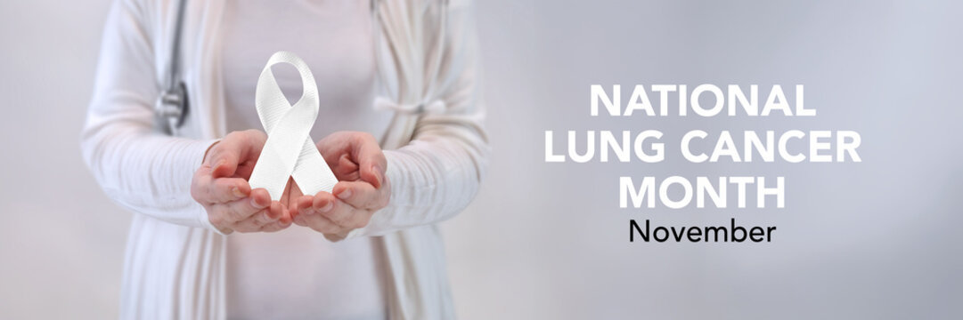 Doctors Hands Presenting White Awareness Ribbon - Lung Cancer Awareness Concept - Powered by Adobe