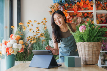 Florist woman having video call on tablet
