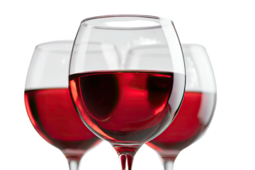 Three glasses filled with red liquid, artfully arranged