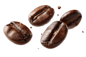 Four roasted coffee beans scattered on a black background