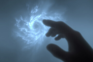 Silhouette of hand reaching toward mysterious glowing spiral in misty atmosphere