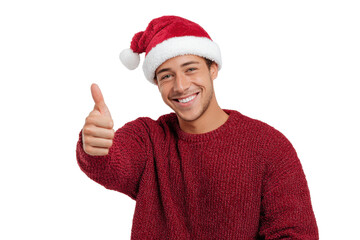 Smiling young man wearing red sweater and Santa hat showing thumbs up, expressing cheerful Christmas spirit, festive celebration, and joyful holiday mood