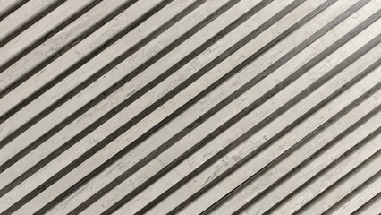 Obraz premium textured cast concrete wall with diagonal lines and stripes in light and shadow