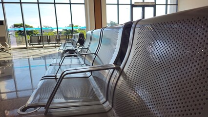 Empty metal chairs in the waiting room at the Laos-China Railway Station