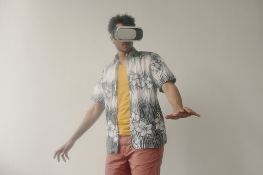 Blurred medium long portrait of student lost in virtual reality