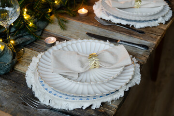 Elegant Christmas table setting. Festive table decorated for Christmas dinner.