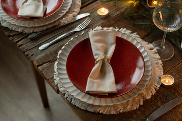 Charming festive table setting. Elegantly designed for joyful Christmas meal.