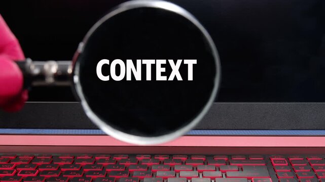 The conceptual text, words, and phrase CONTEXT appear on a black screen, background through a magnifying glass. Business concept. Animated Video
