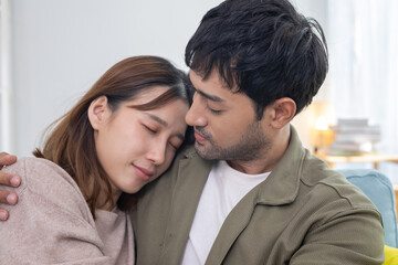 couple smile and happy hug each other eyes, cuddling, warm hugs, young love, married couple, warm family. Husband and wife in love so fun in new years eve or valentine day