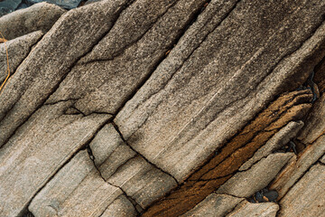 Diagonal strata on weathered stone creating linear texture. High quality photo