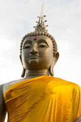 Close-up of a Large Golden-Robed Buddha Statue in Thailand
